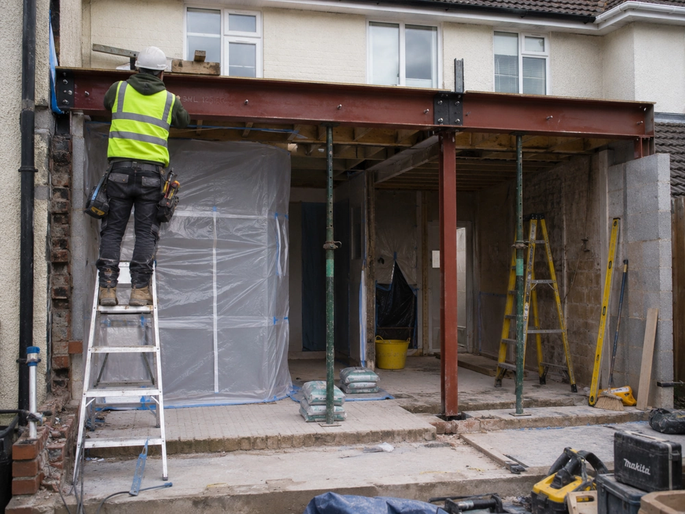 Construction worker fitting steel beams for Rear Extension