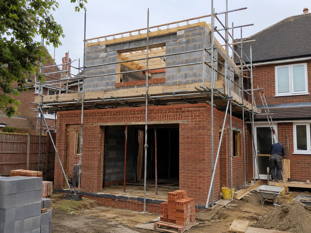Double Storey Extension under construction in brick and block with scaffolding