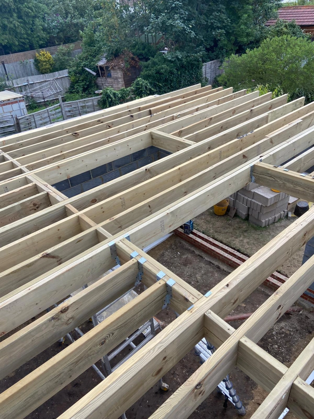 Timber floor joists installed on blockwork walls for Single Storey Extension construction