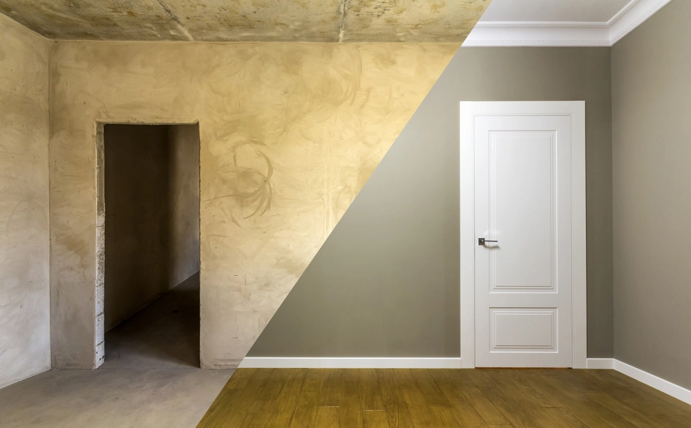 Half wall showing raw plaster and finished painted interior with white door and wood flooring, Home Renovation