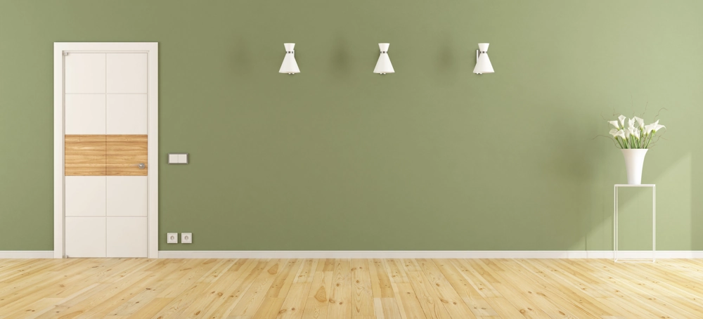 Modern interior with green painted walls, light wood flooring, white door and wall lights – Interior Painting