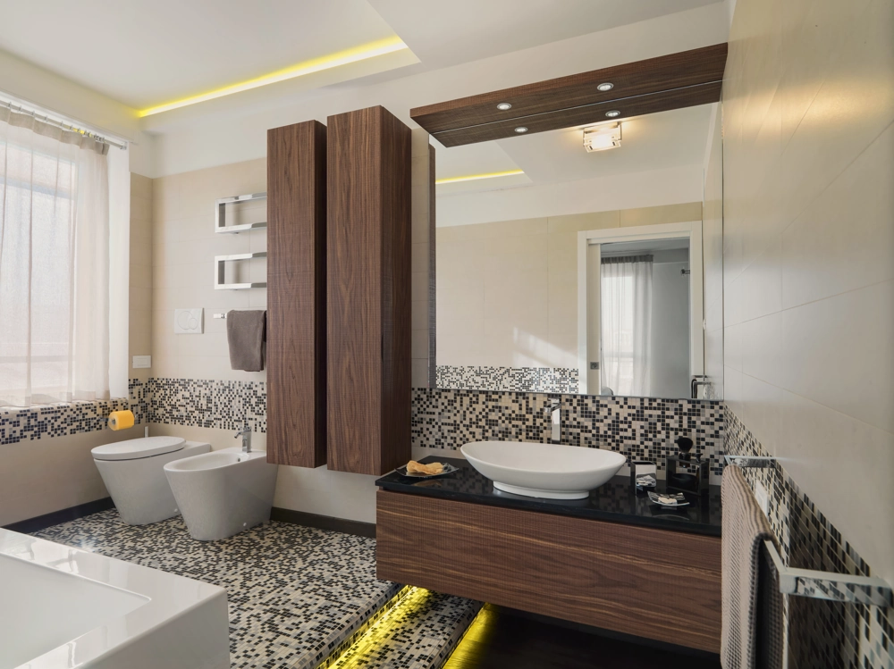 Bathroom Renovation: modern space with mosaic floor and wall tiling, wood vanity with vessel sink, bidet and toilet
