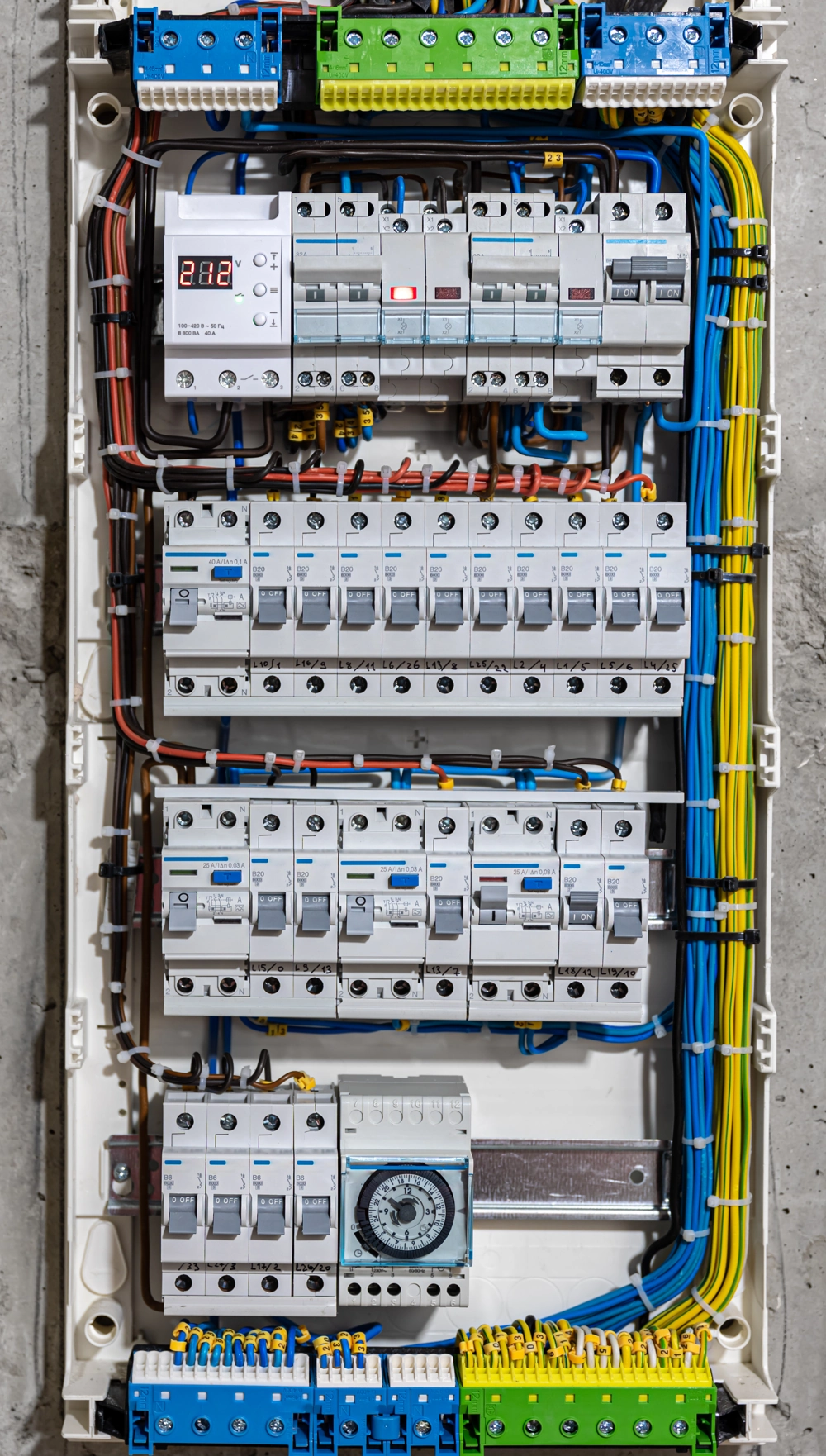 Open electrical distribution board showing circuit breakers and neatly arranged wiring for Electrical Services